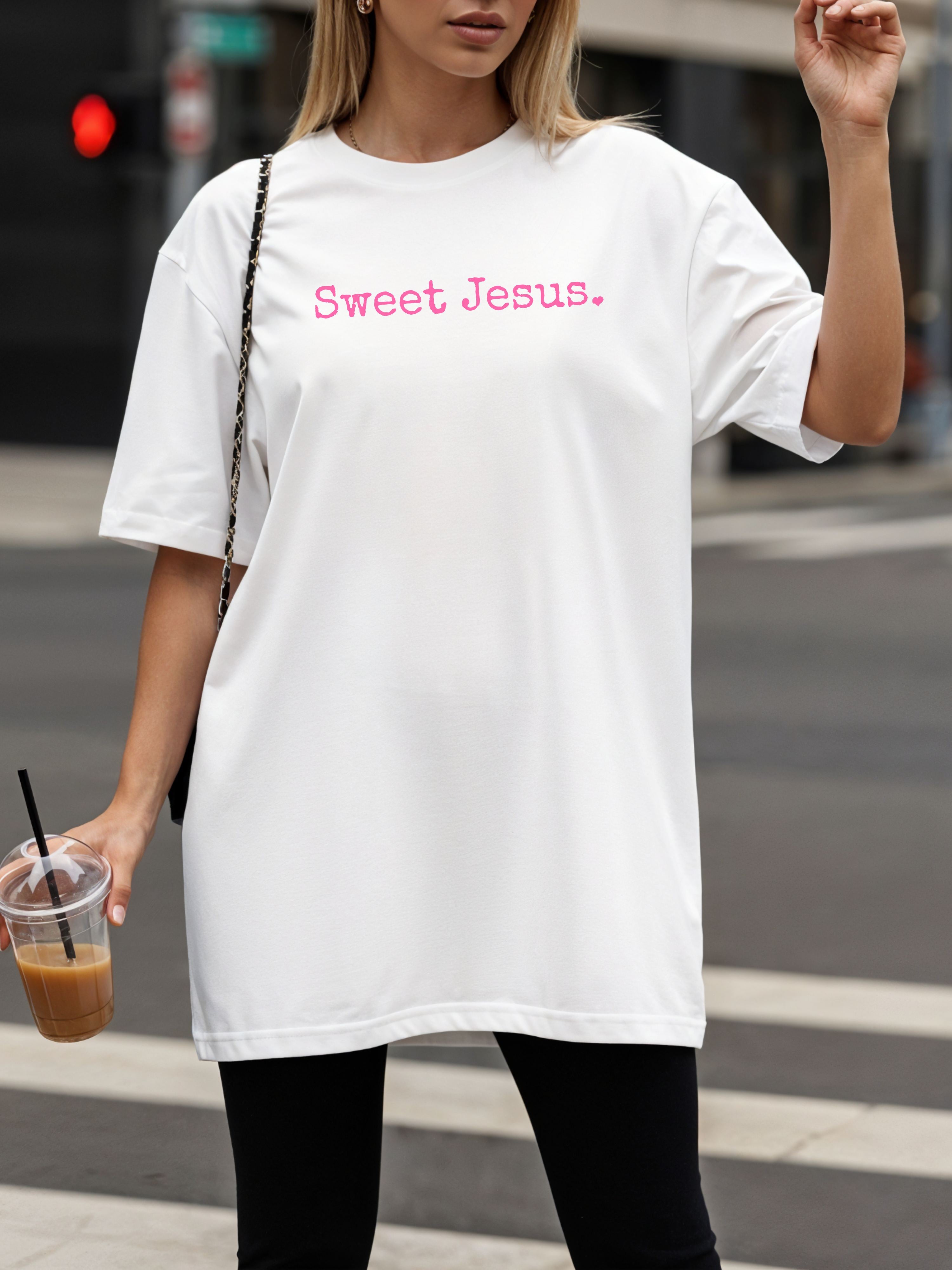 Woman wearing a white cotton t-shirt with 'Sweet Jesus' pink text.